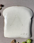 vue arrière assiette tartine madame timide